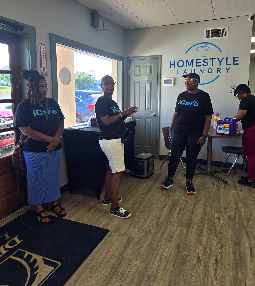 iCare volunteers from Intentional Church with detergent and supplies at a Laundry Love outreach