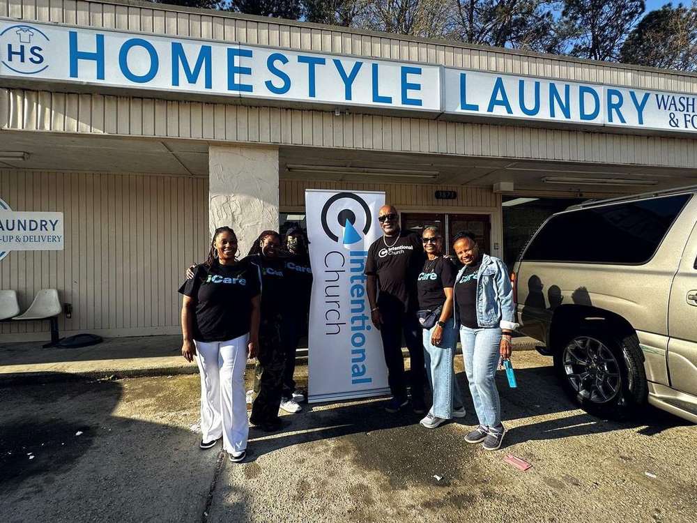 The iCare outreach team from Intentional Church outside Homestyle Laundry in Powder Springs, Georgia