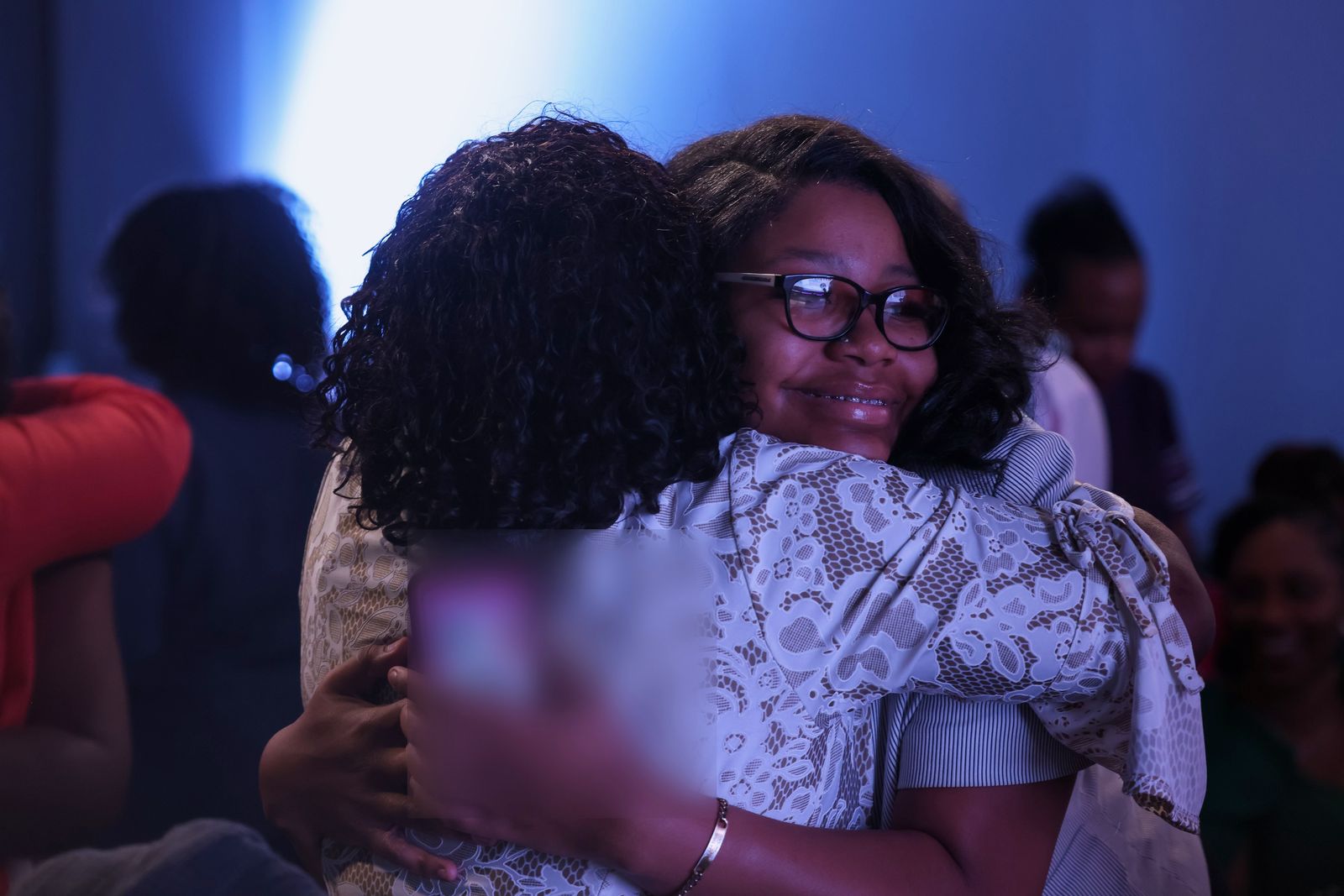 Two partners embracing during a Sunday gathering at Intentional Church in Powder Springs, Georgia